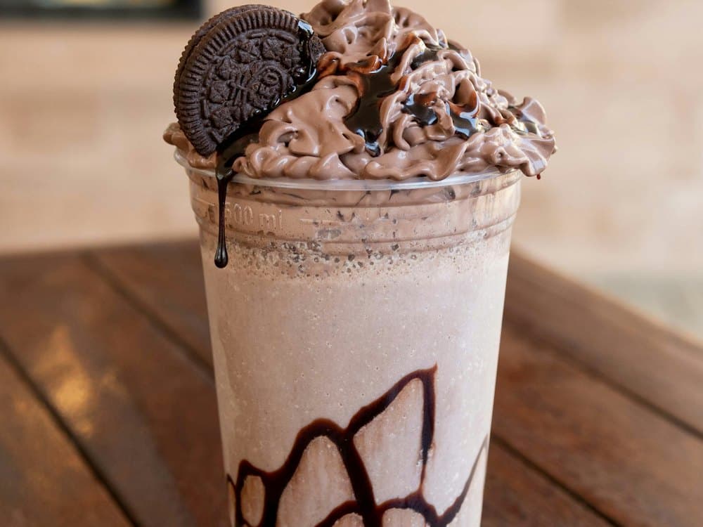 Chocolate Oreo thickshake topped with cream